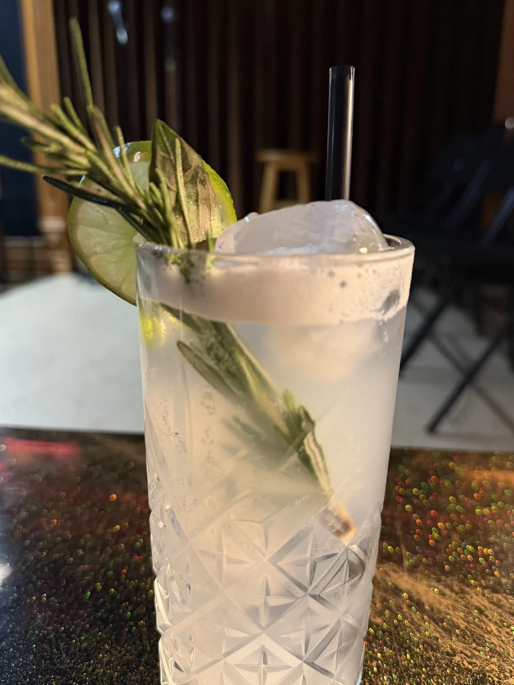 Close-up of rosemary garnish on a Gin Smash