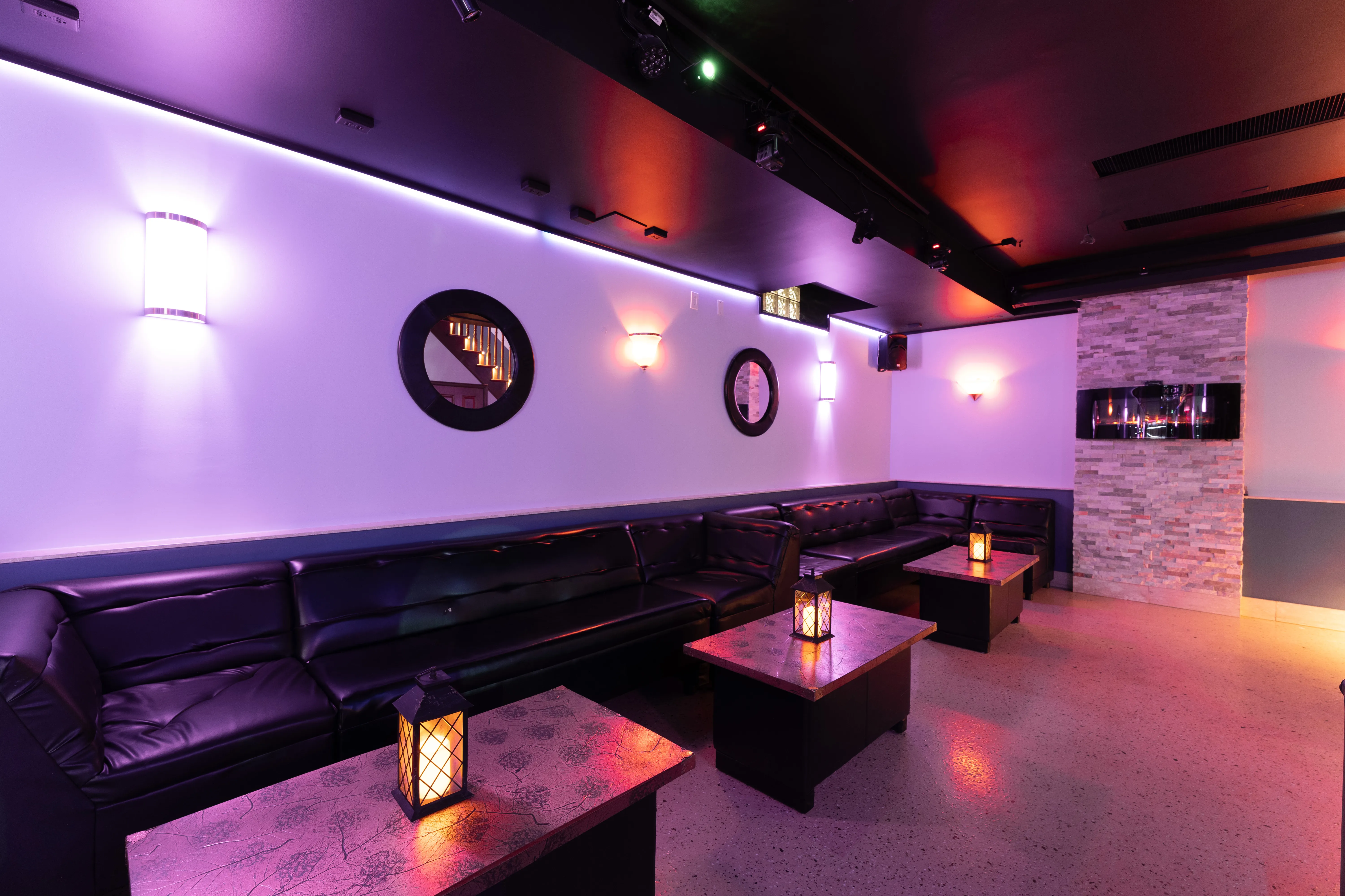 Private lounge Toronto bar area with mood lighting