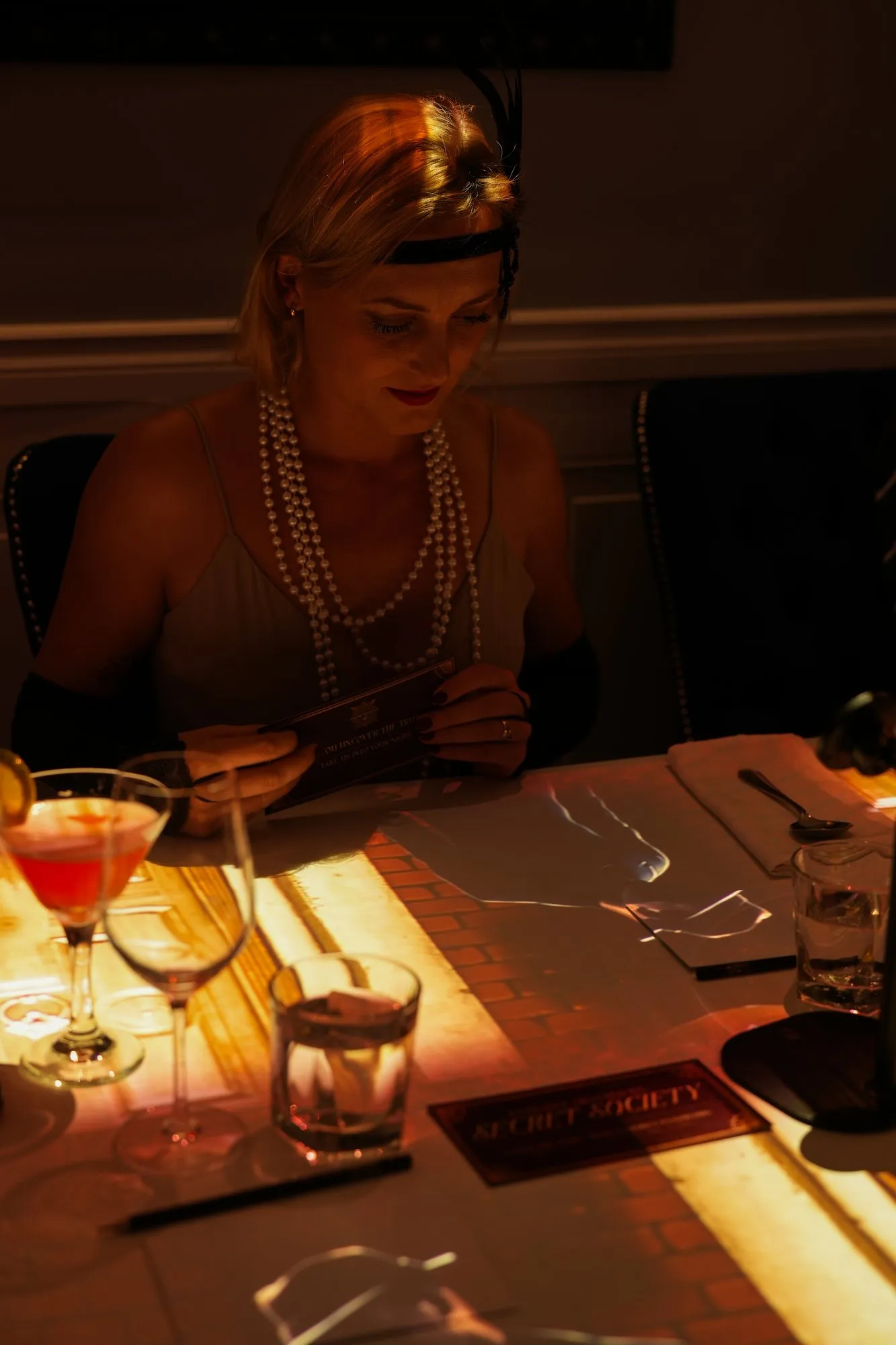 A guest in pearls at the Secret Society media launch