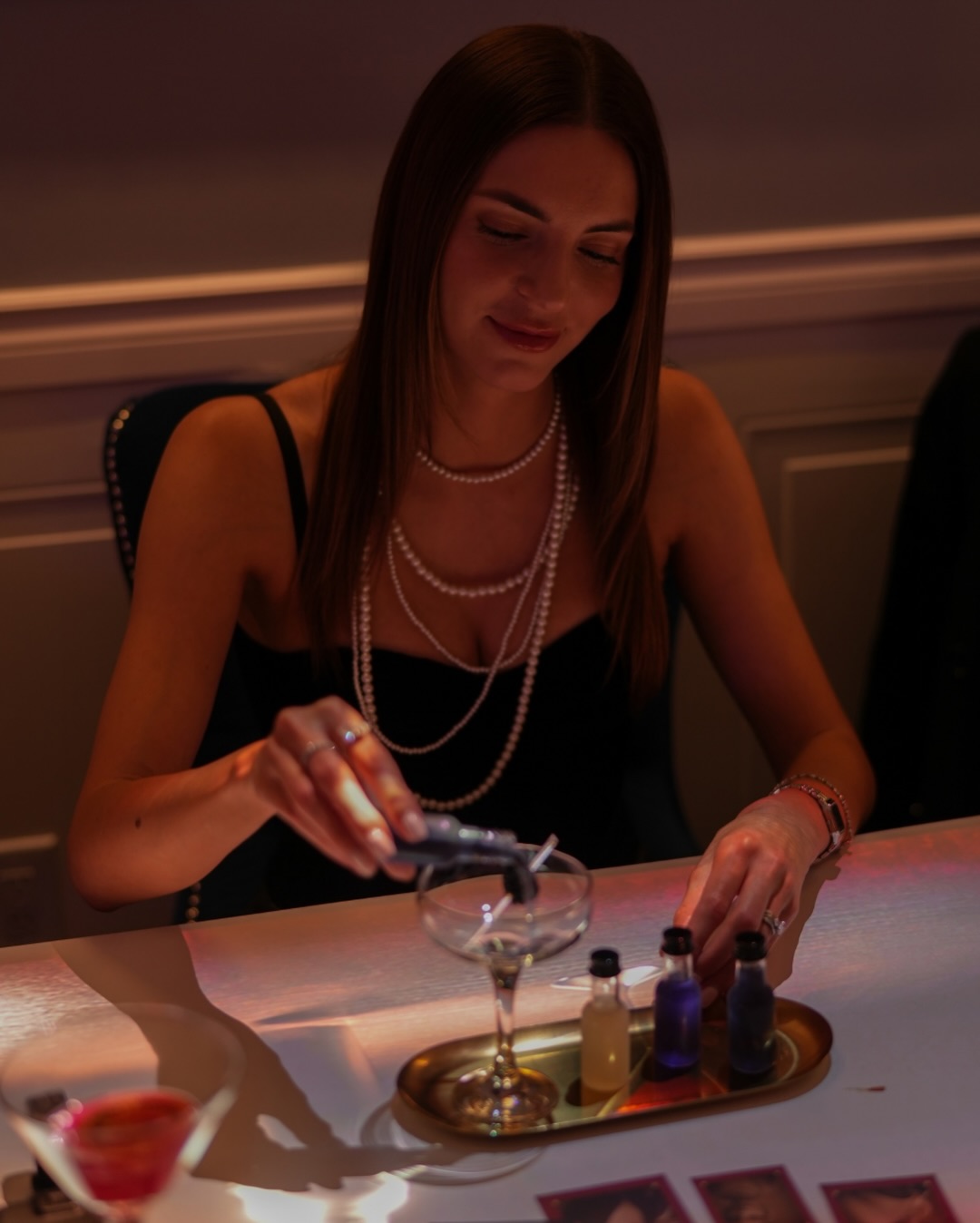 A guest mixing a cocktail at Secret Society